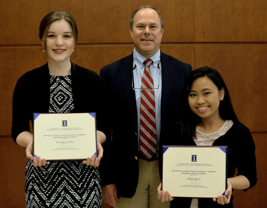 2 students being awarded scholarships