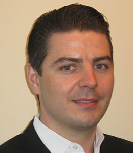 headshot of Curano