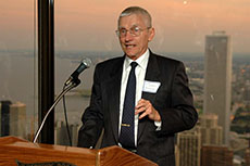 man speaking at a podium