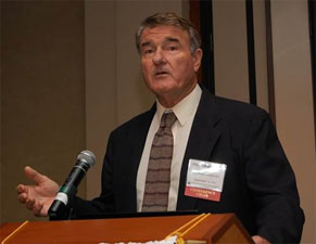 man speaking at a podium
